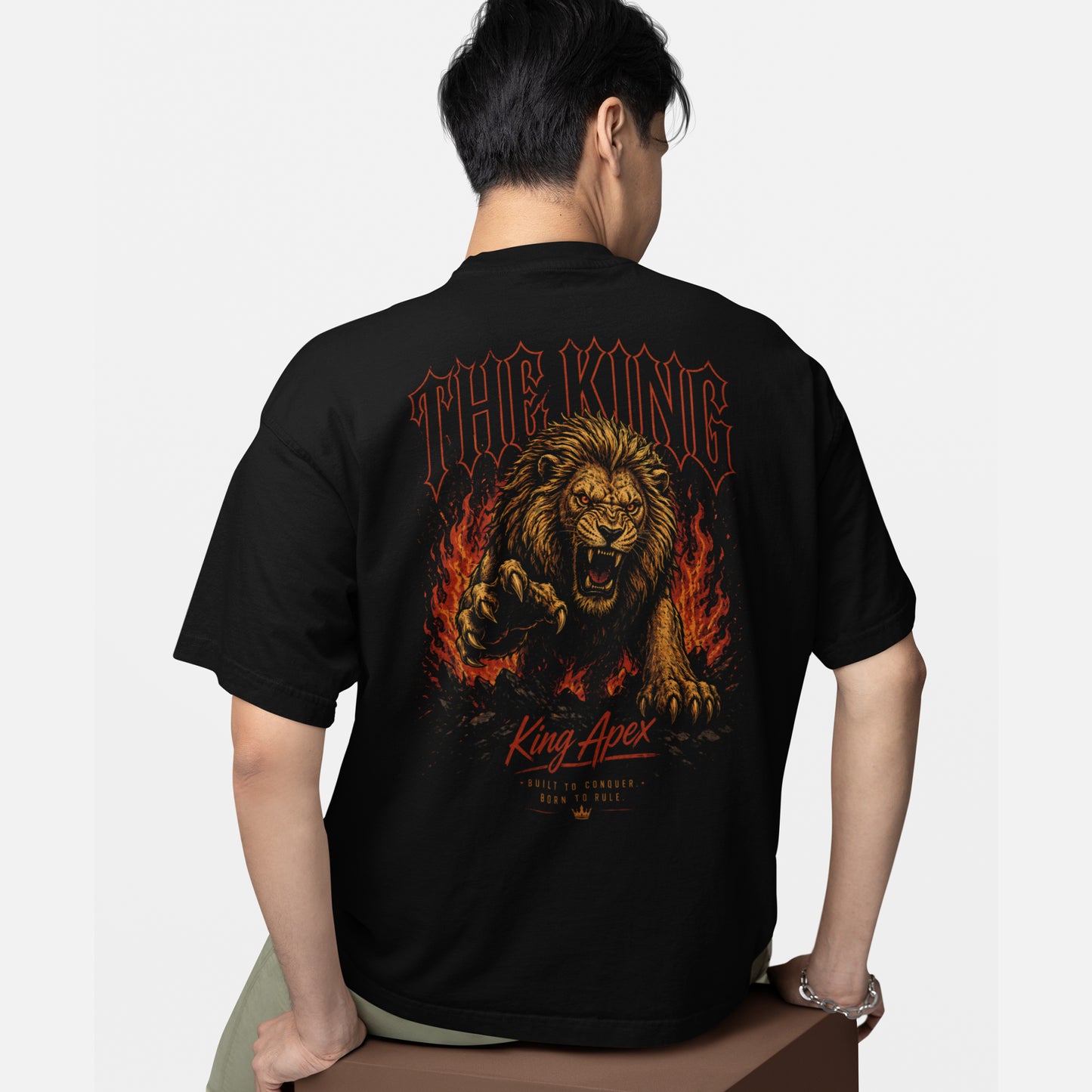 model wearing KING APEX oversized black t-shirt Fire Fury lion design
