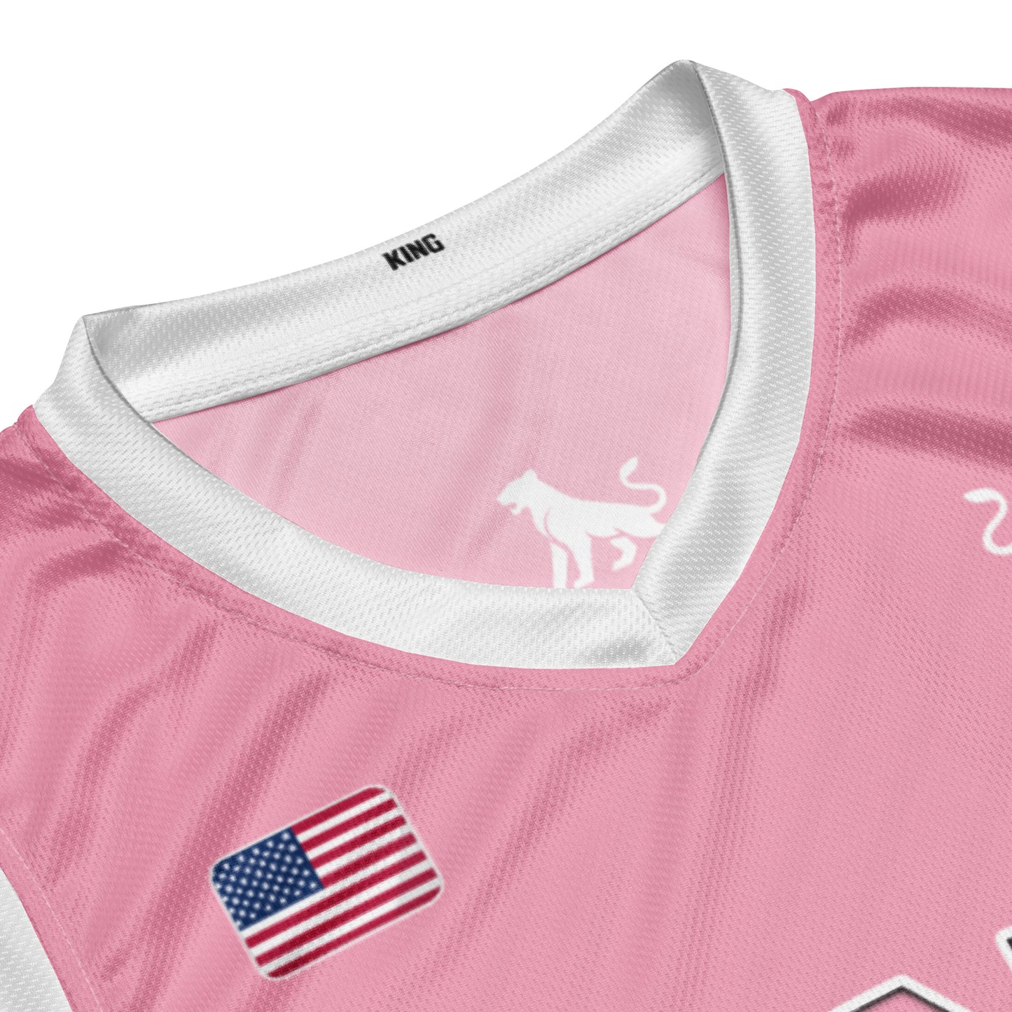 Close-up of pink KING basketball jersey Lioness edition showing fabric, stitching and logo detail