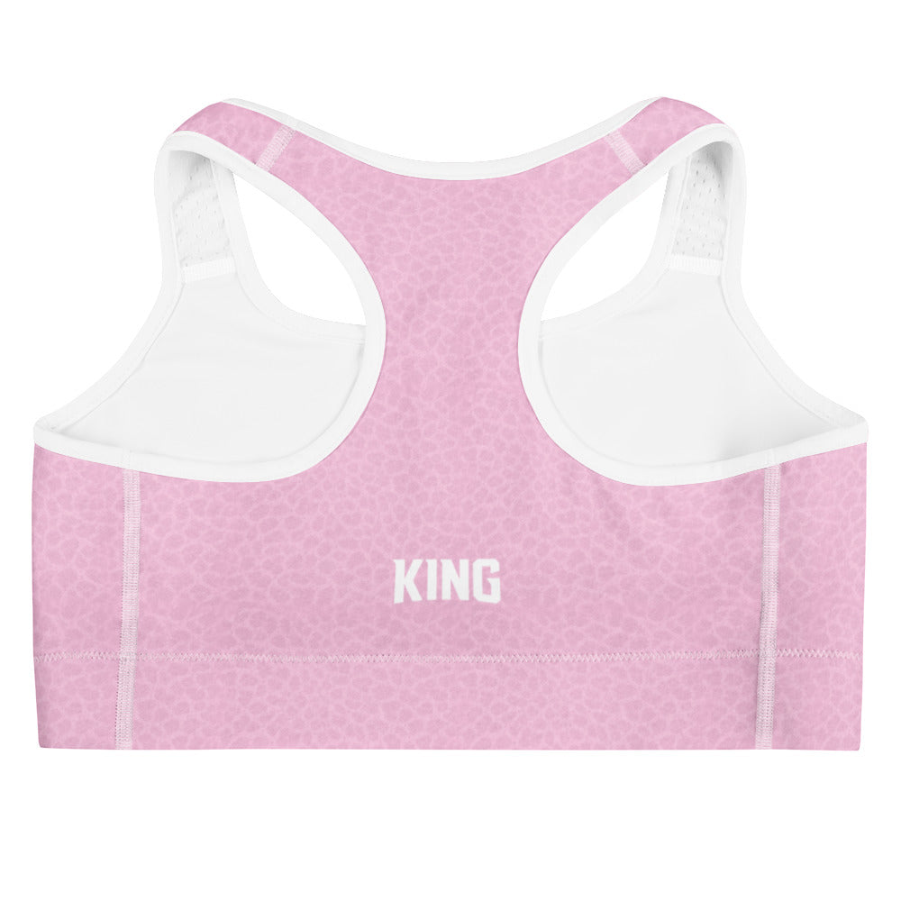 Back view of KING Lioness sports bra showing racerback design in rose textured fabric