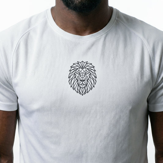 Male model wearing the KING white sports jersey with geometric lion chest emblem — side view.
