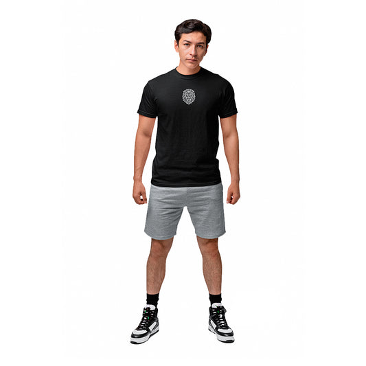 Full-body view of male model wearing black KING sports tee with geometric lion emblem.