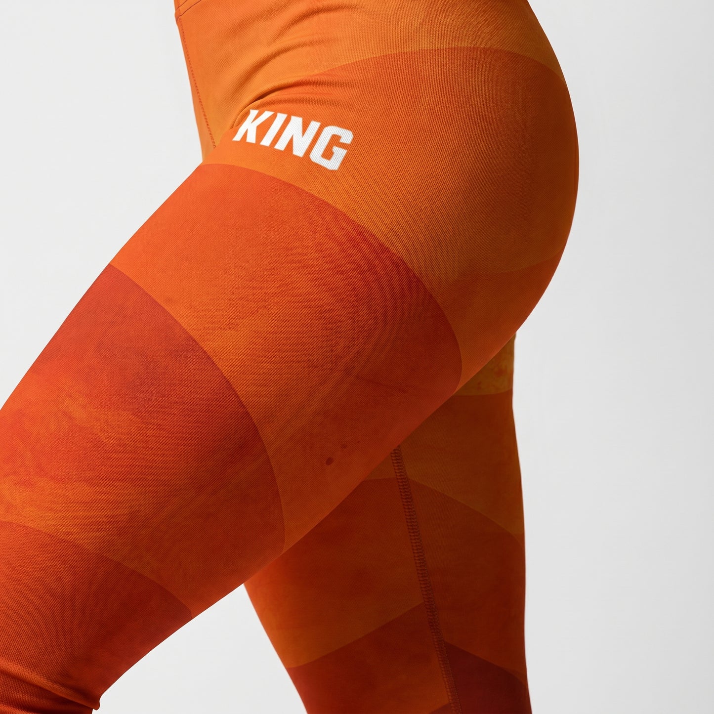 Close-up detail of KING Lioness Savannah Leggings Earth Edition earth-tone pattern