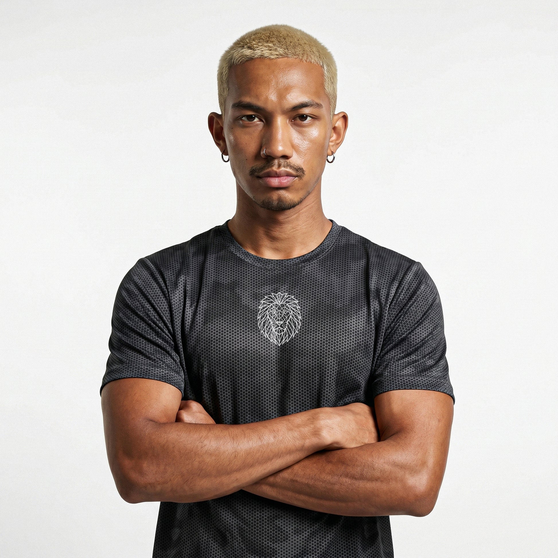 Male model wearing KING APEX iron grey camo performance tee with geometric lion logo front view