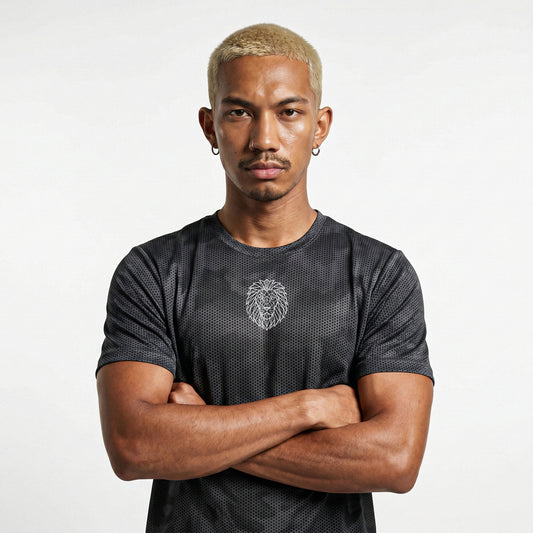 Male model wearing KING APEX iron grey camo performance tee with geometric lion logo front view