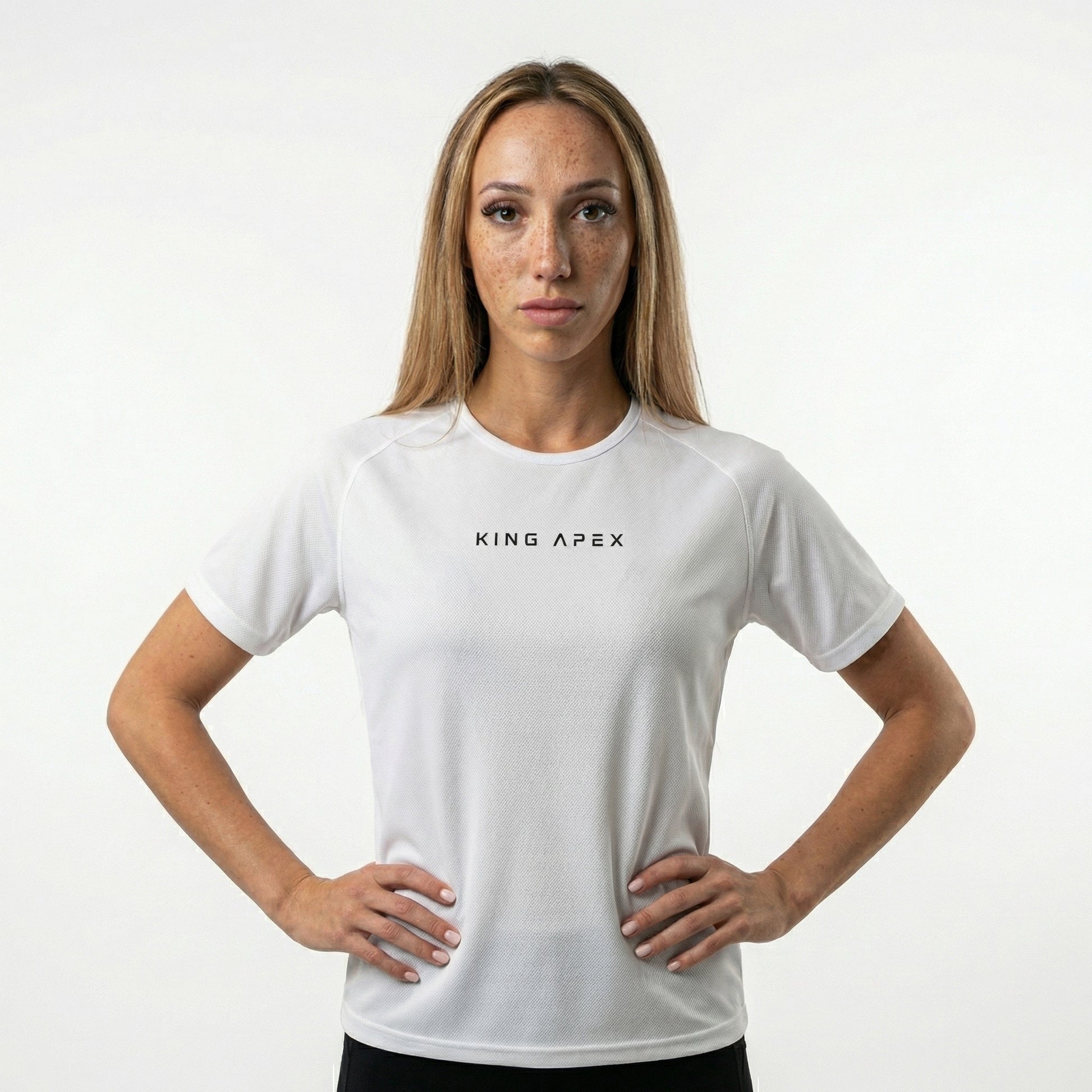 KING APEX Core Sports Jersey Black – woman with a minimal athletic performance t-shirt front view.