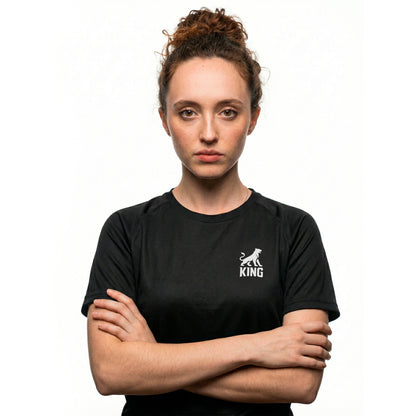 Woman wearing KING APEX black sports jersey with minimal lioness logo on chest