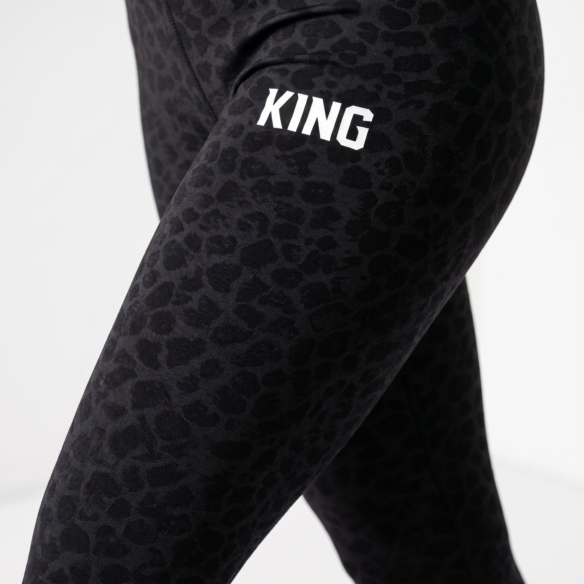 Close-up of premium black texture on KING APEX leggings