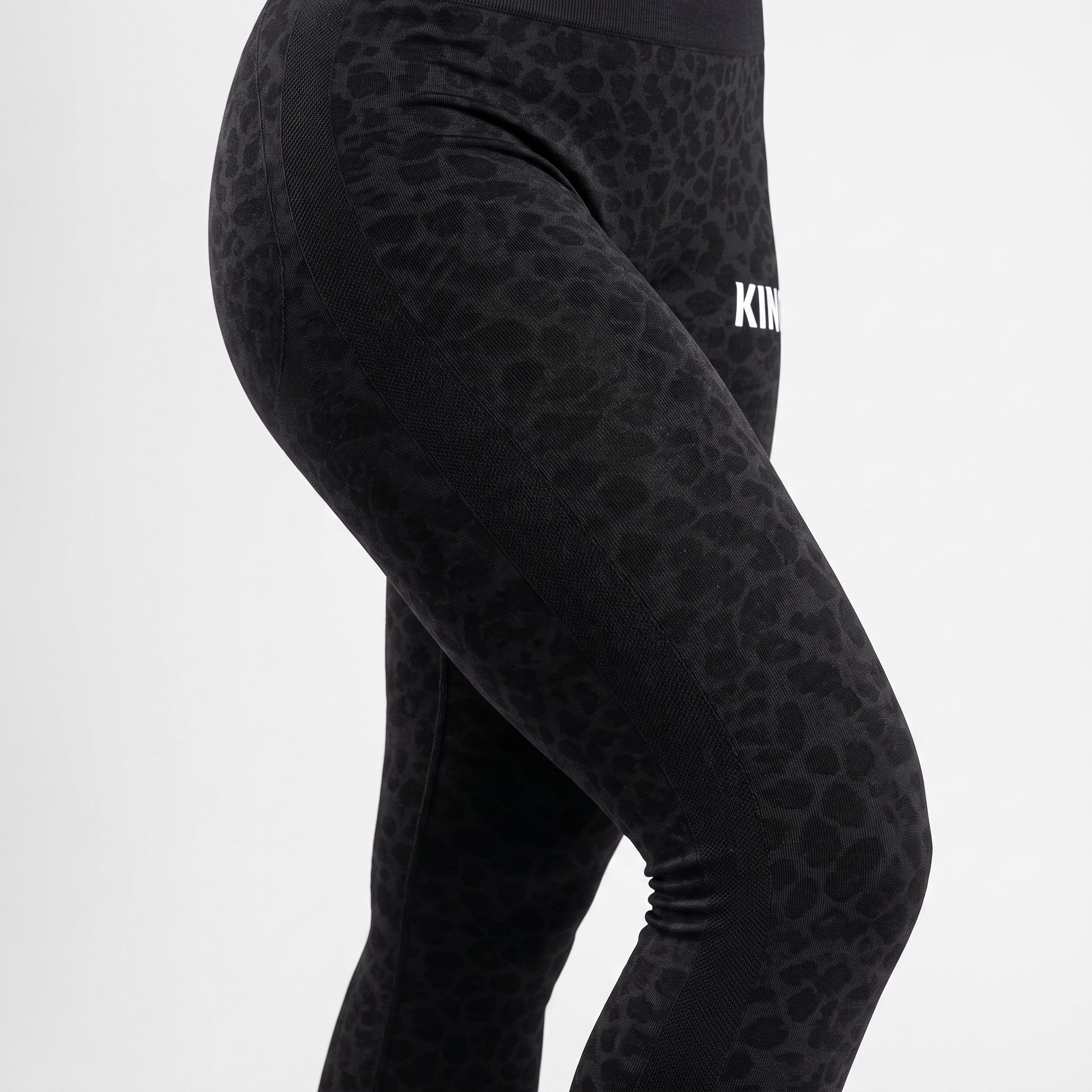 Close-up of premium black texture on KING APEX leggings