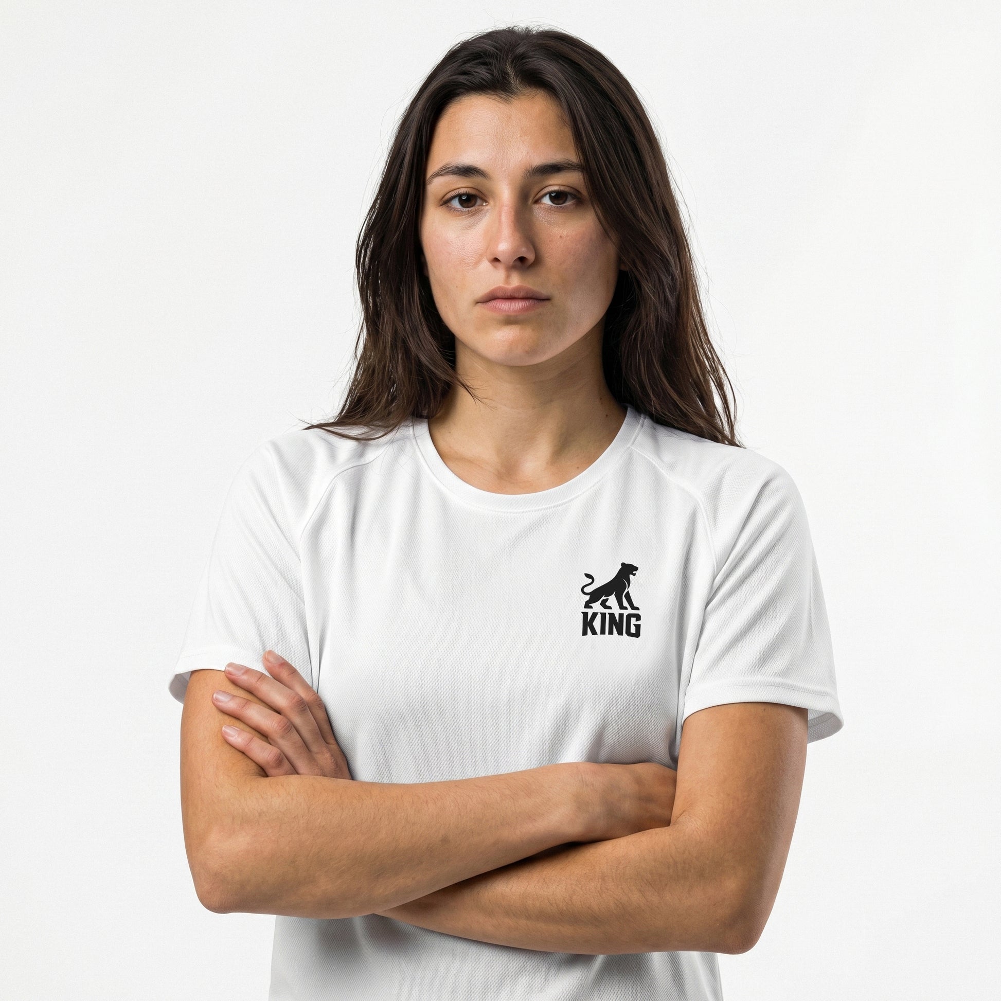 Female model wearing KING APEX white athletic sports jersey with minimal lioness logo
