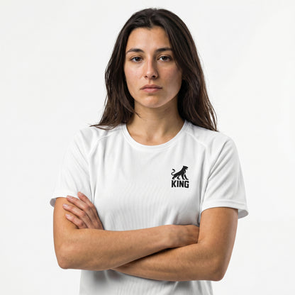 Female model wearing KING APEX white athletic sports jersey with minimal lioness logo
