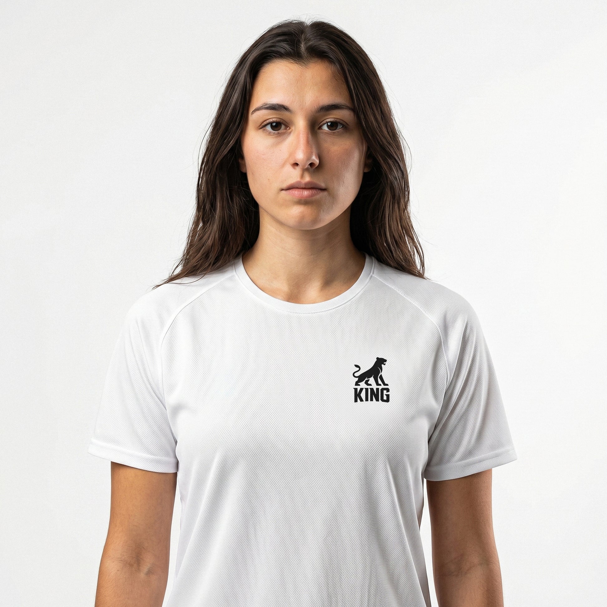 Woman wearing KING APEX white sports jersey with minimal lioness logo on chest