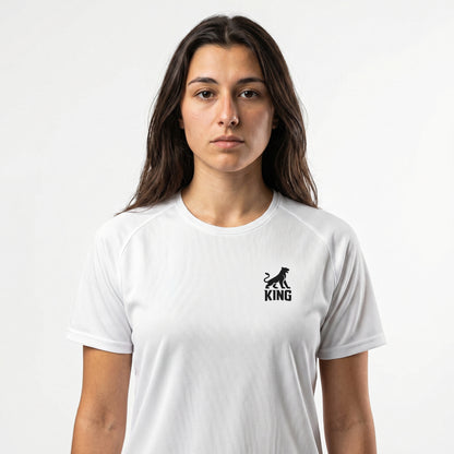 Woman wearing KING APEX white sports jersey with minimal lioness logo on chest