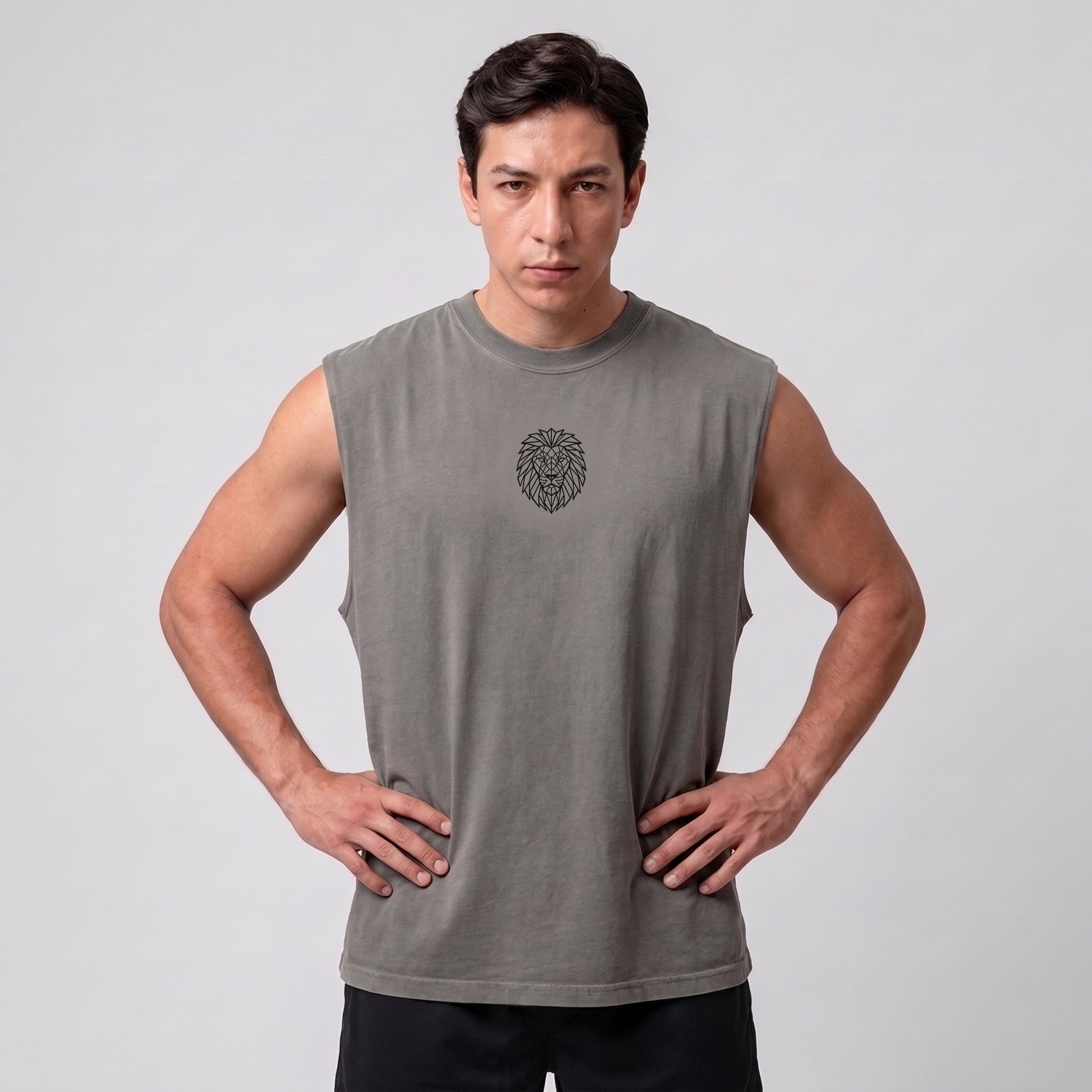 Male model wearing the KING APEX Men's Heavy Faded Tank in Stone Grey, front view with hands on hips.