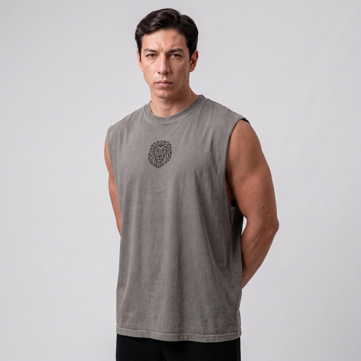 Male model wearing the KING APEX Men's Heavy Faded Tank in Stone Grey, three-quarter front view.