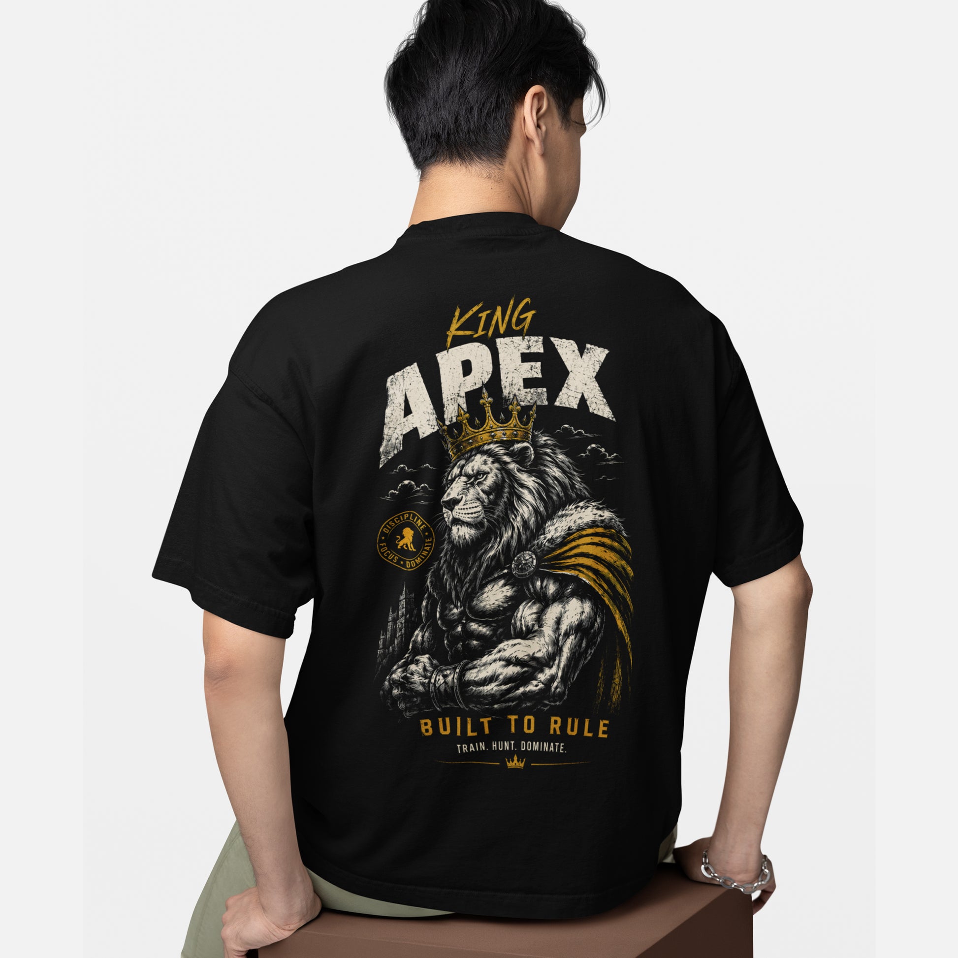 model wearing KING APEX oversized black t-shirt Built to Rule design