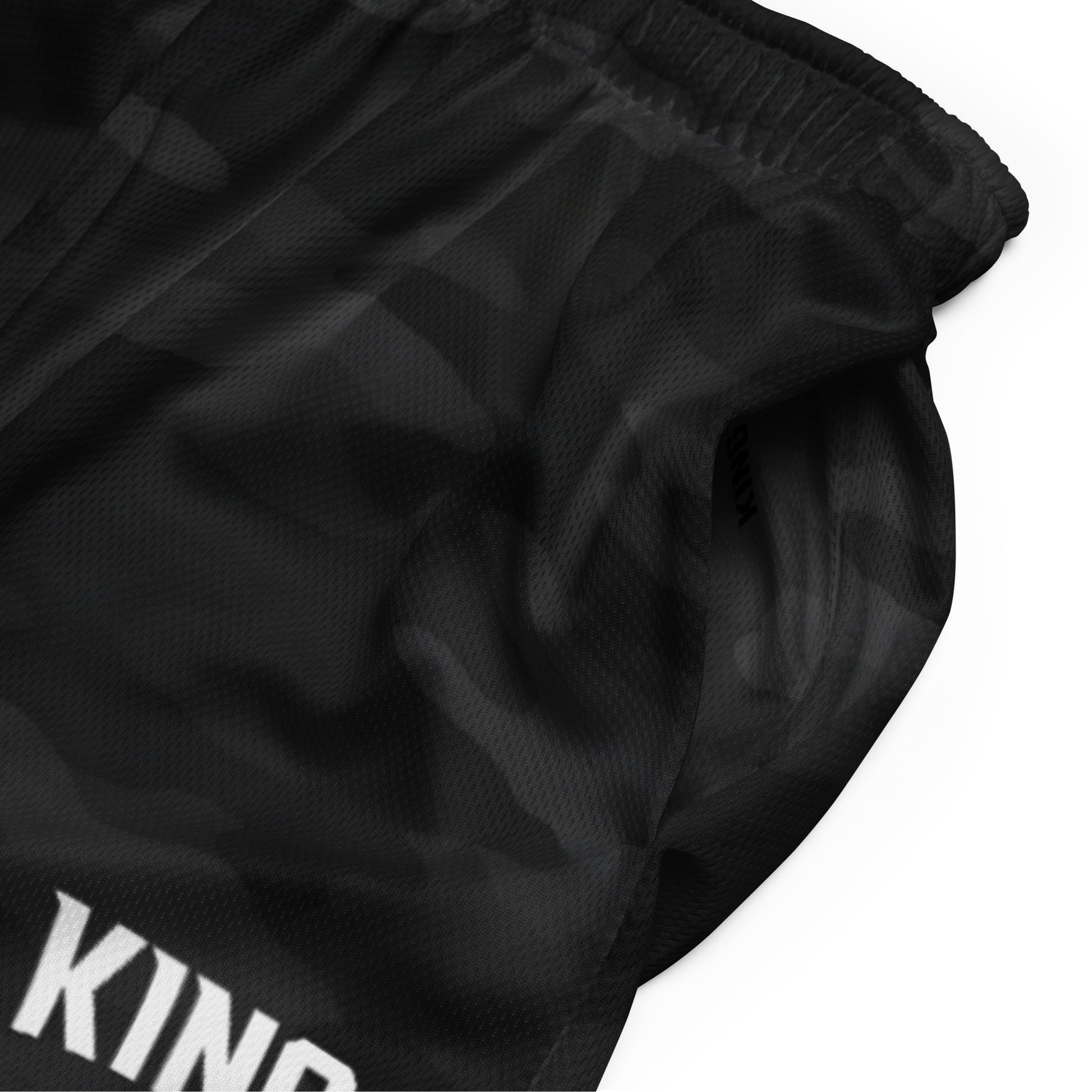 Side close-up KING logo on mesh — Shadow Camo Edition Shorts