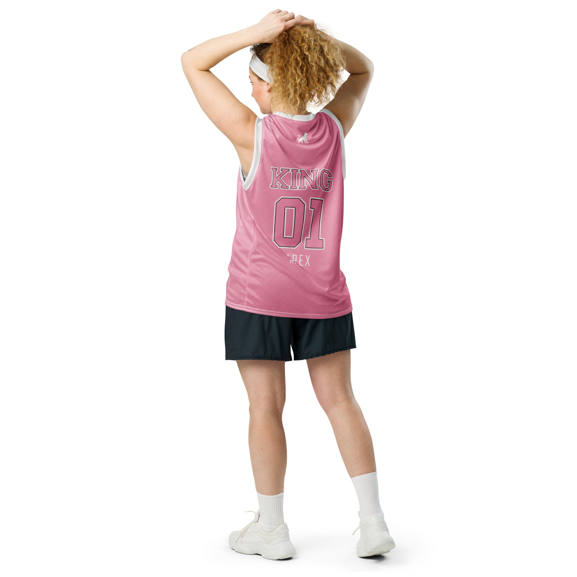 Back view of pink KING basketball jersey Lioness edition worn by female model