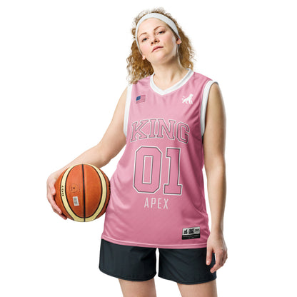 Female model wearing pink KING basketball jersey Lioness edition with minimalist lioness logo closer view.