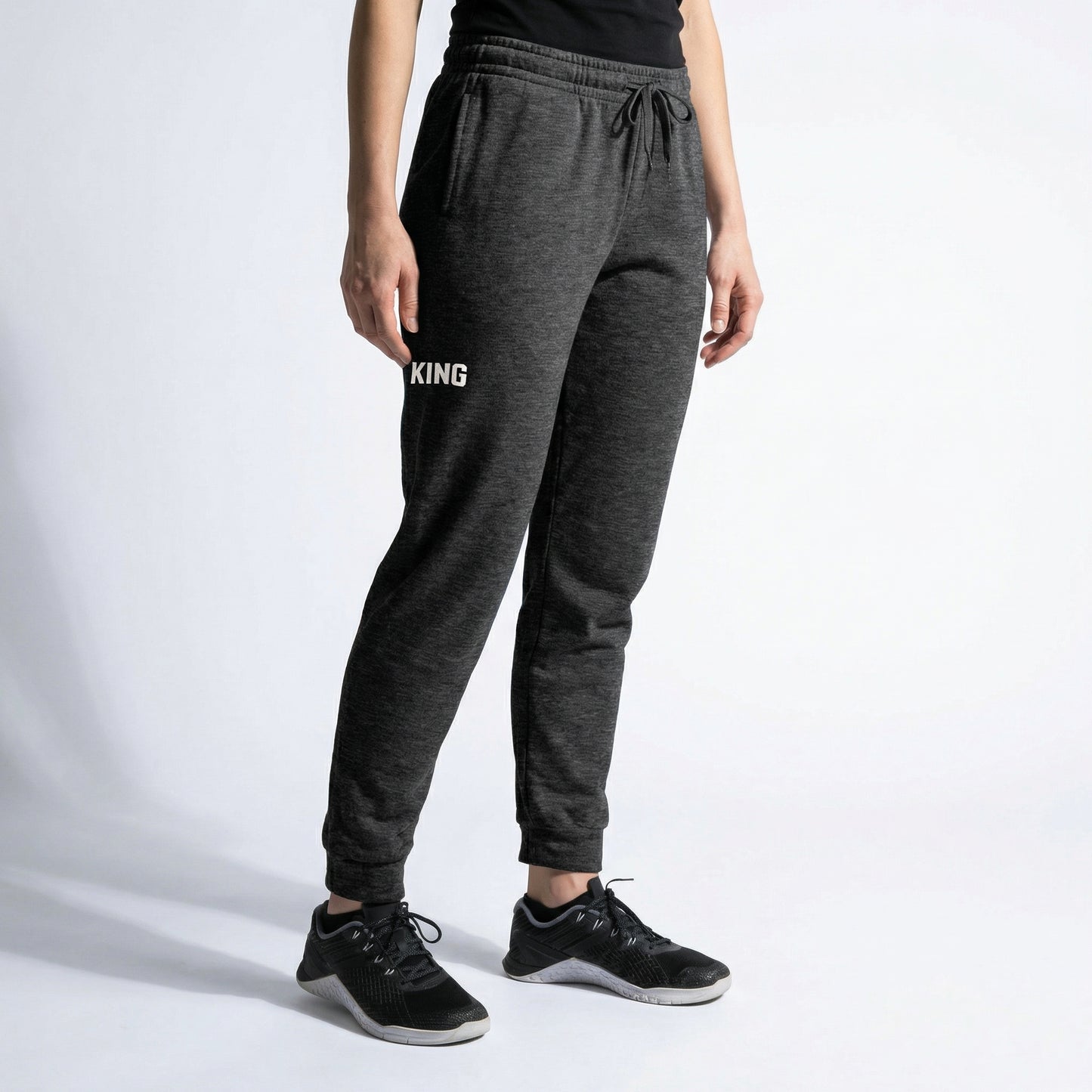 Dark Heather KING joggers angled view showing tapered fit and minimal logo