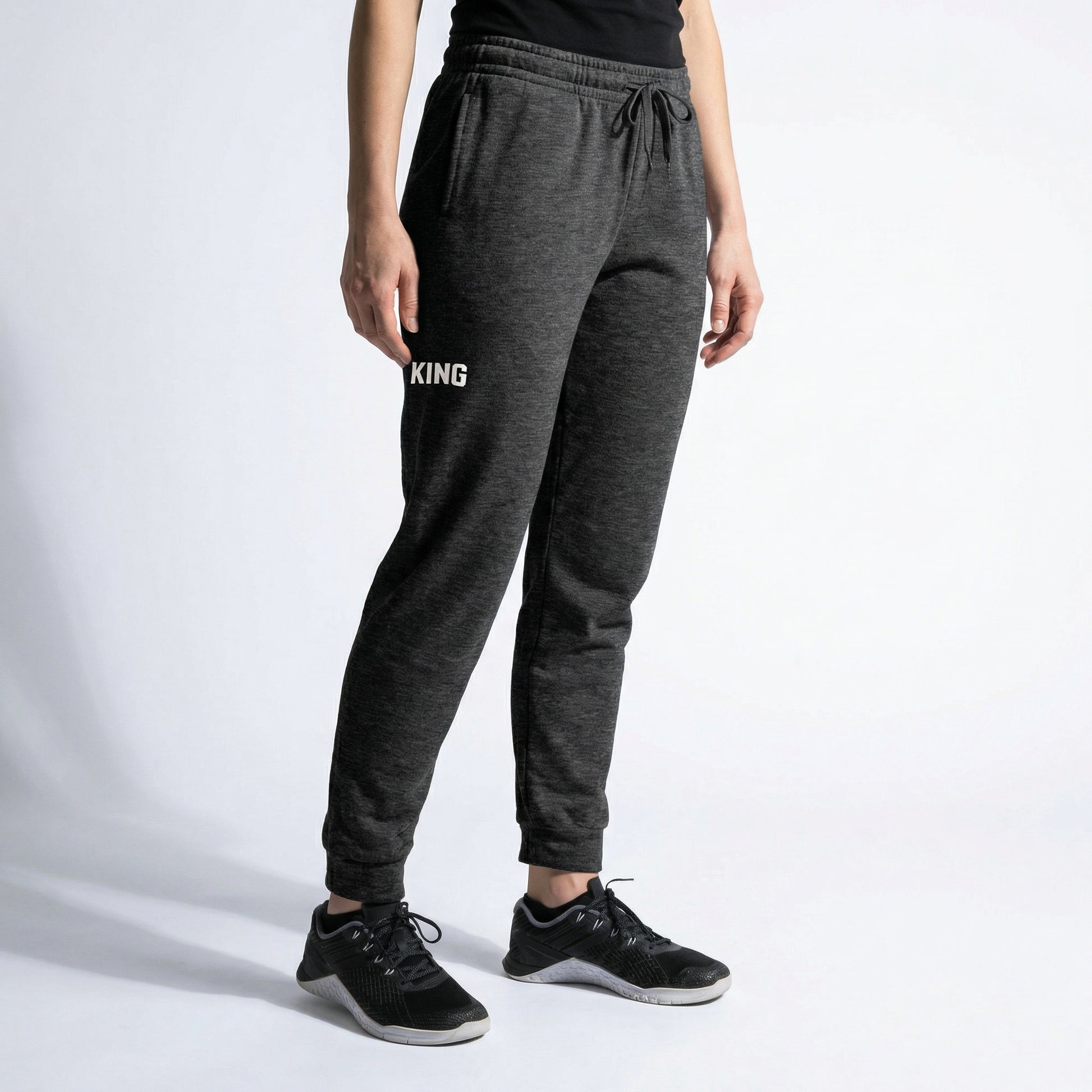 Dark Heather KING joggers angled view showing tapered fit and minimal logo