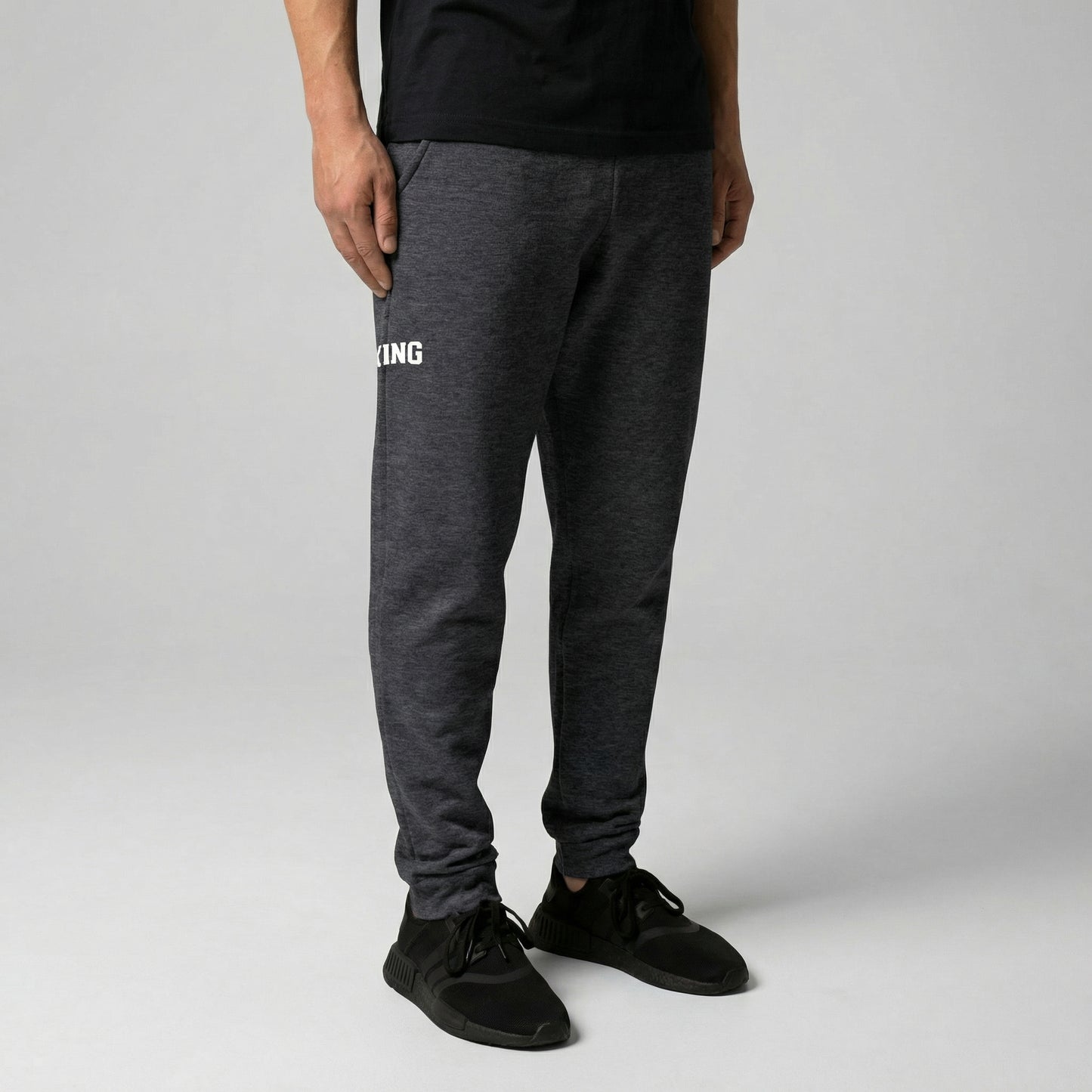 Dark Heather KING joggers angled view showing tapered fit and minimal logo