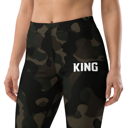 Close-up of the high-rise waist and white KING logo on Lioness Jungle military camo leggings.