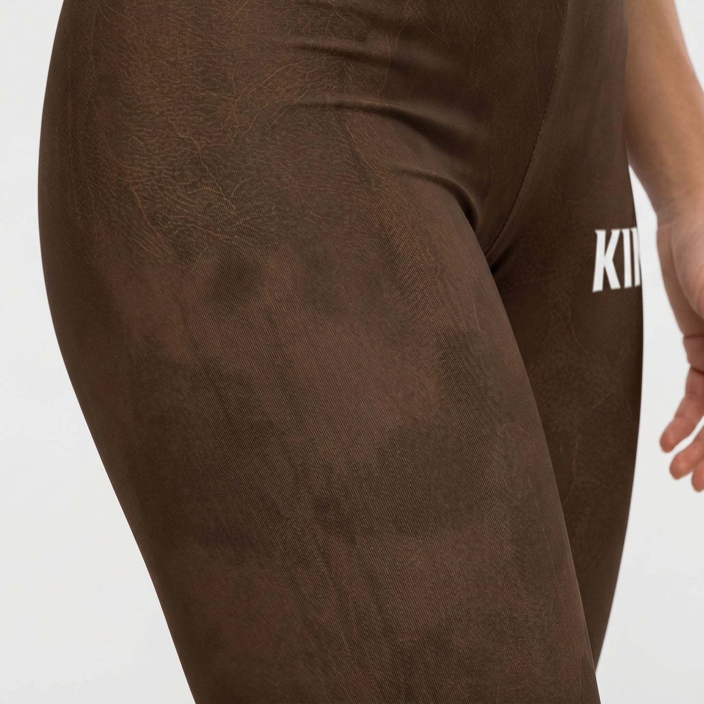 Fit and fabric detail of KING Lioness Savannah Pattern Leggings Earth Edition
