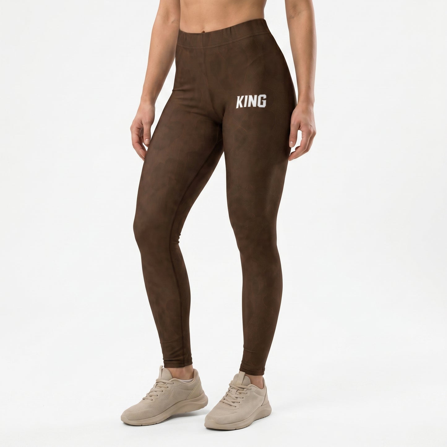 Female model wearing KING Lioness Savannah Pattern Leggings Earth Edition full body view