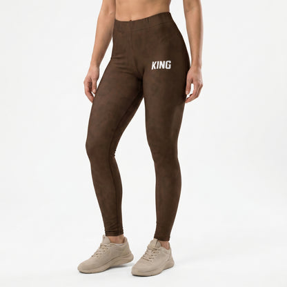 Female model wearing KING Lioness Savannah Pattern Leggings Earth Edition full body view