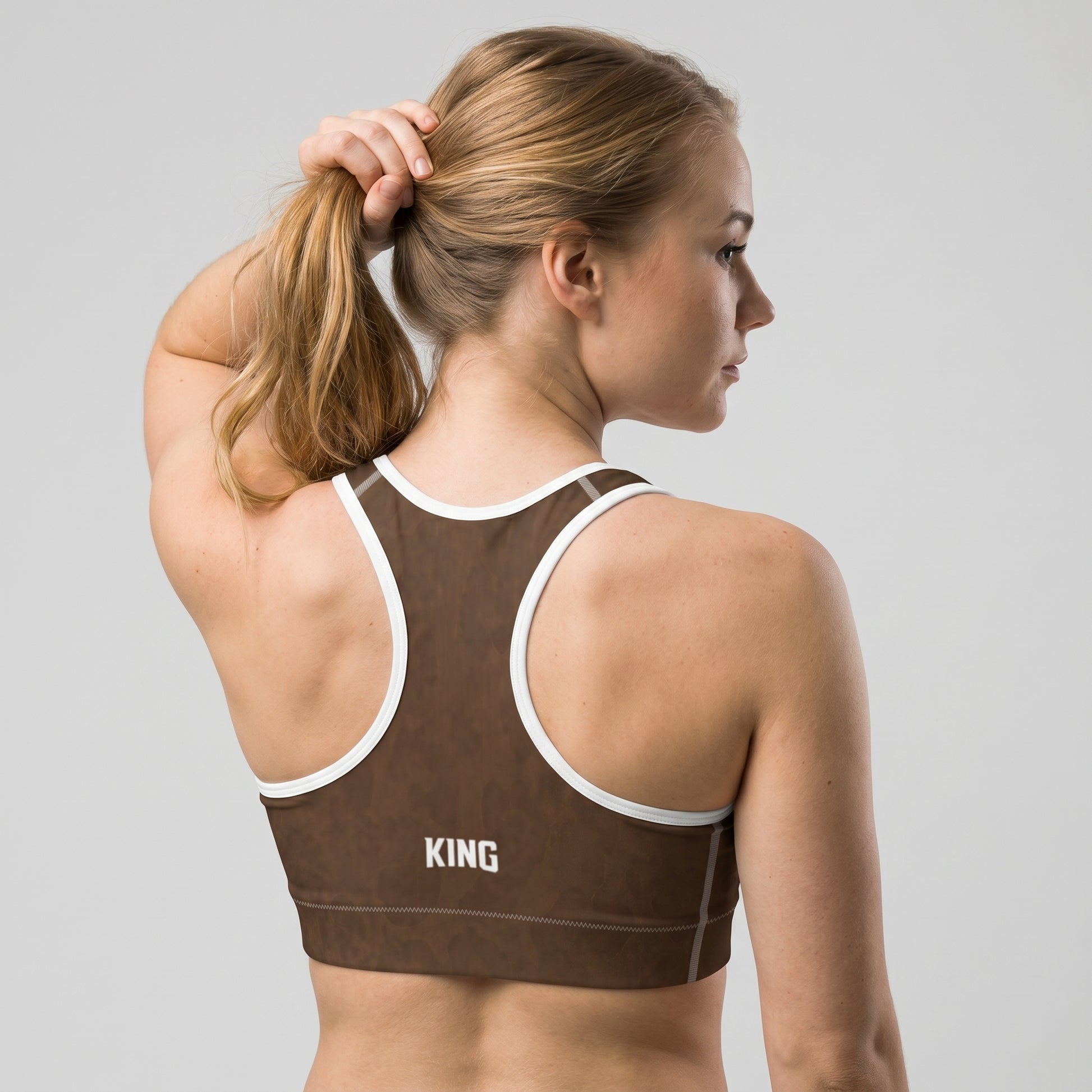 Back view of the KING Lioness Savannah Pattern Sports Bra showing the racerback design.