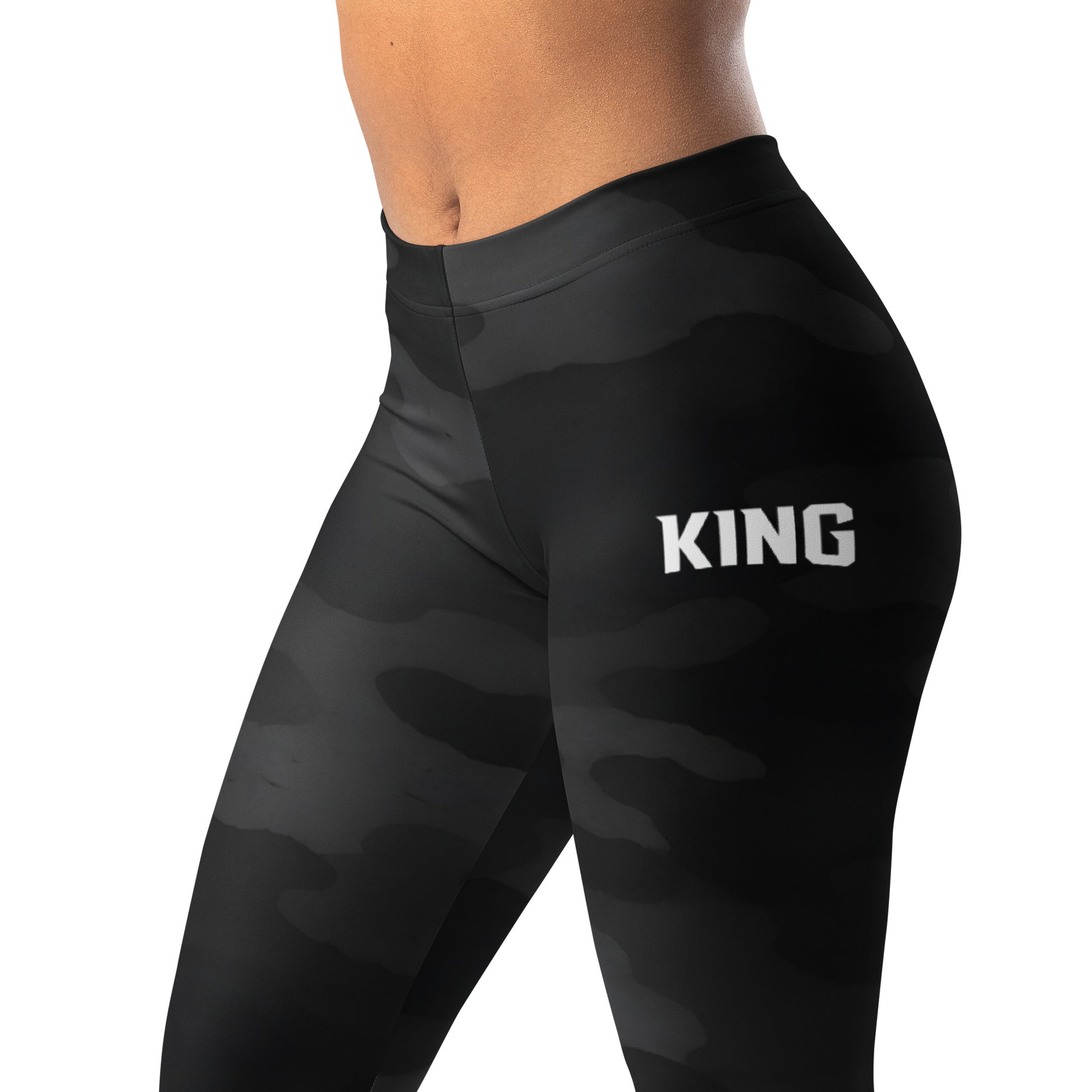 Close-up of KING logo on Lioness shadow camo performance leggings
