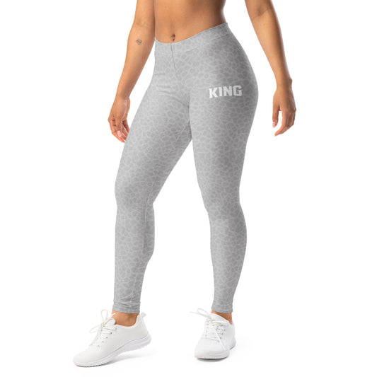 Woman wearing KING Lioness Shadow Camo leggings in gray color, front view