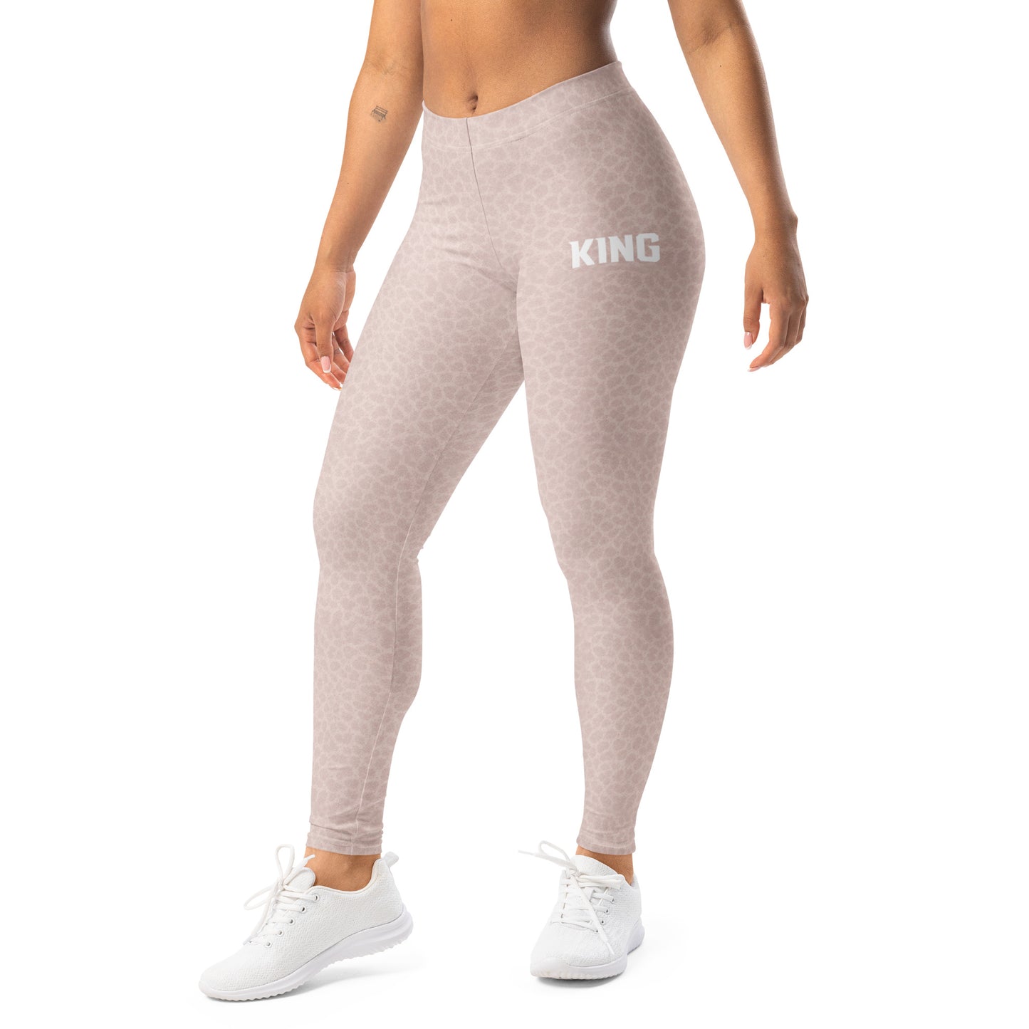Woman wearing KING Lioness Shadow Camo leggings in rose color, front view premium fit