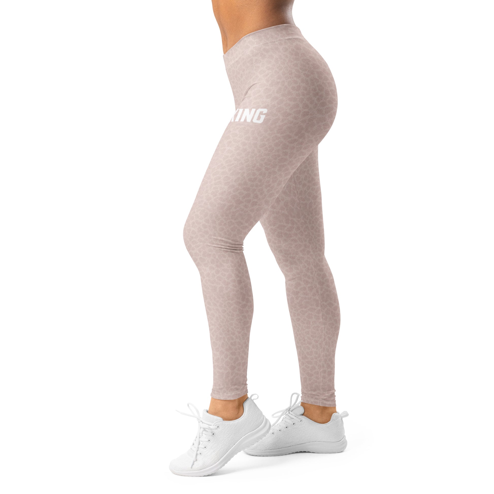 Side view of woman wearing KING Lioness rose camo leggings in motion