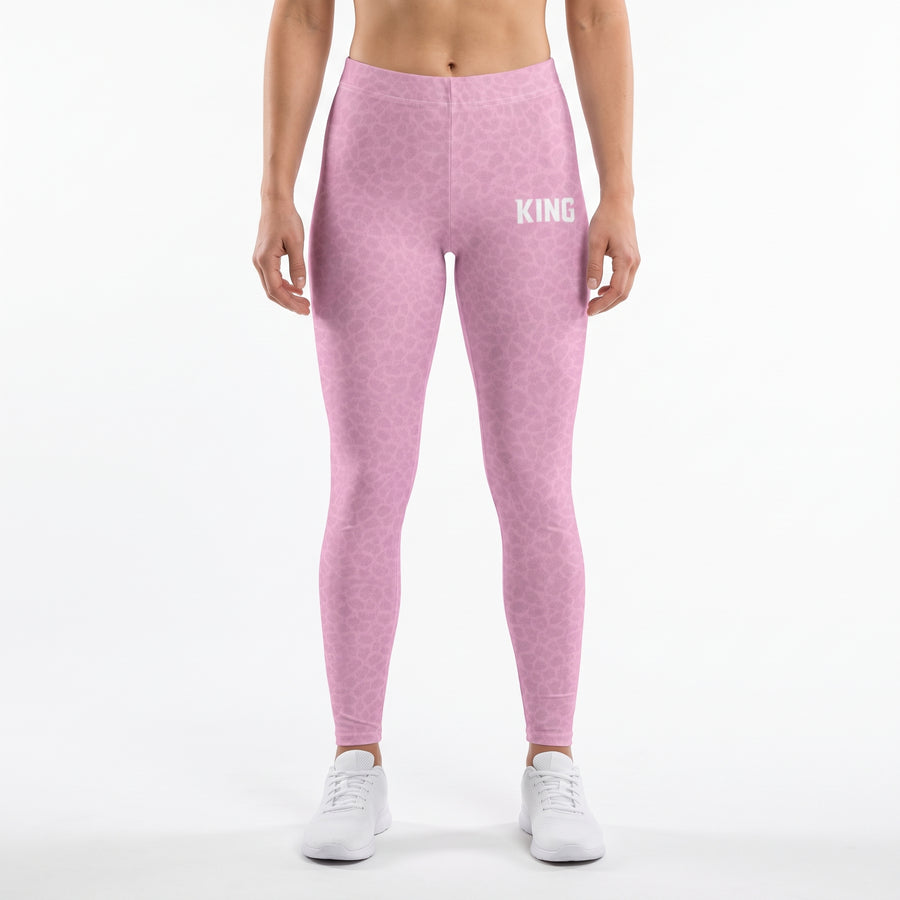 Front view of a model wearing KING APEX Lioness Soft Rose shadow pattern high-waisted gym leggings.
