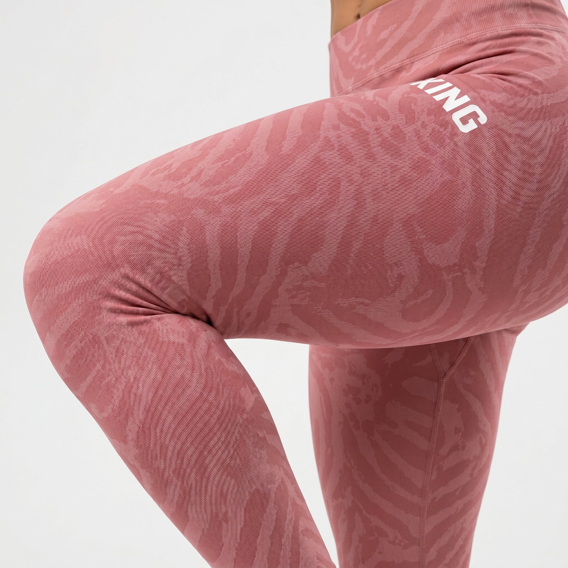 Front standing view of premium soft rose performance leggings by KING APEX