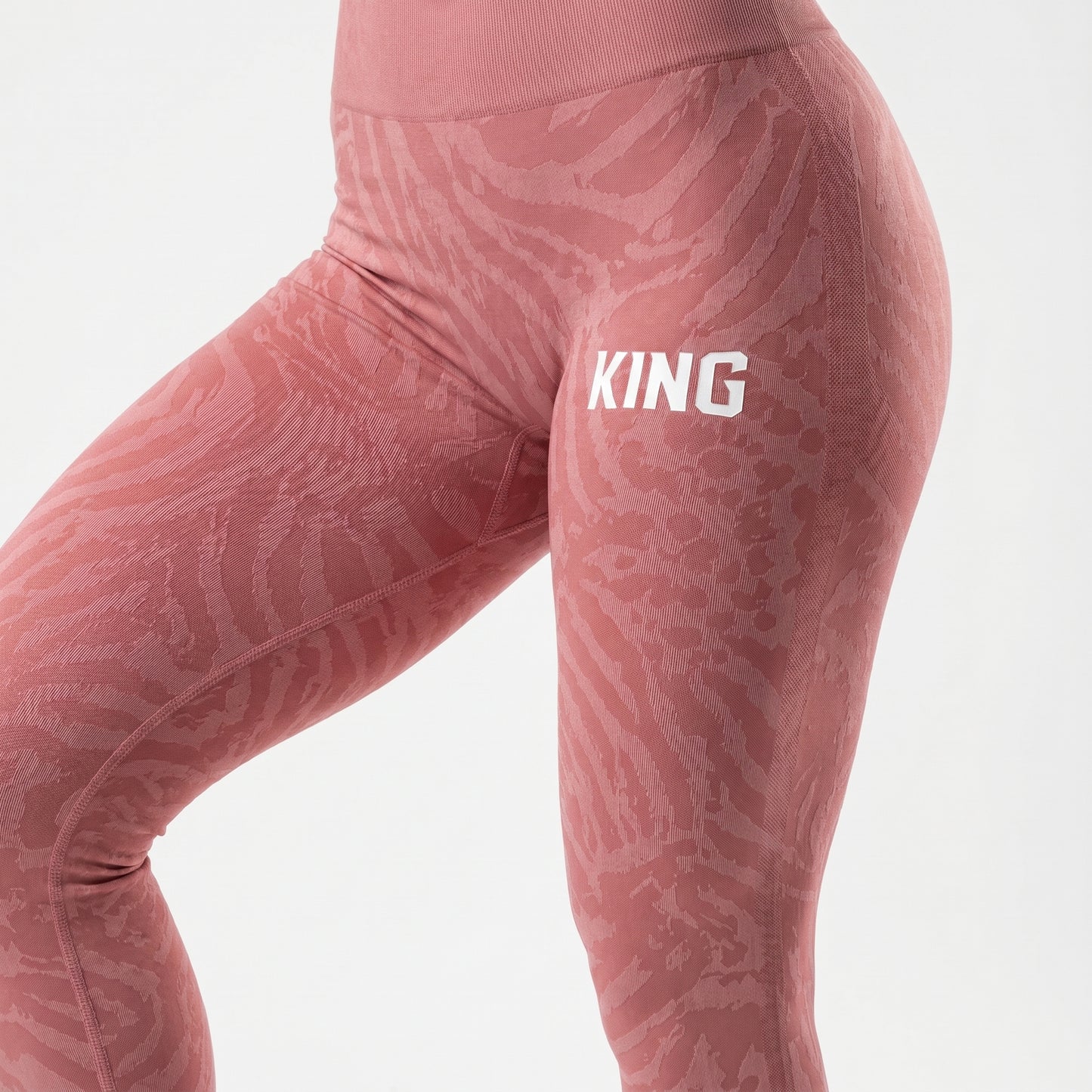 Side-angle view of soft rose women’s leggings with sculpted athletic fit