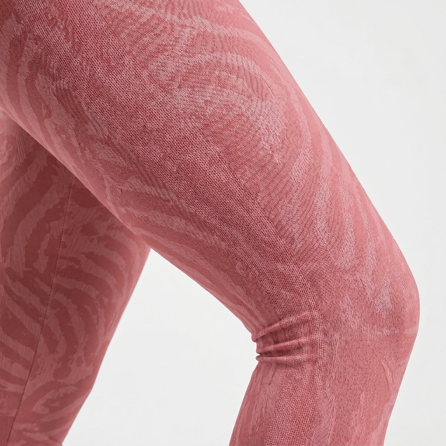 Detailed texture close-up of soft rose shadow pattern activewear leggings
