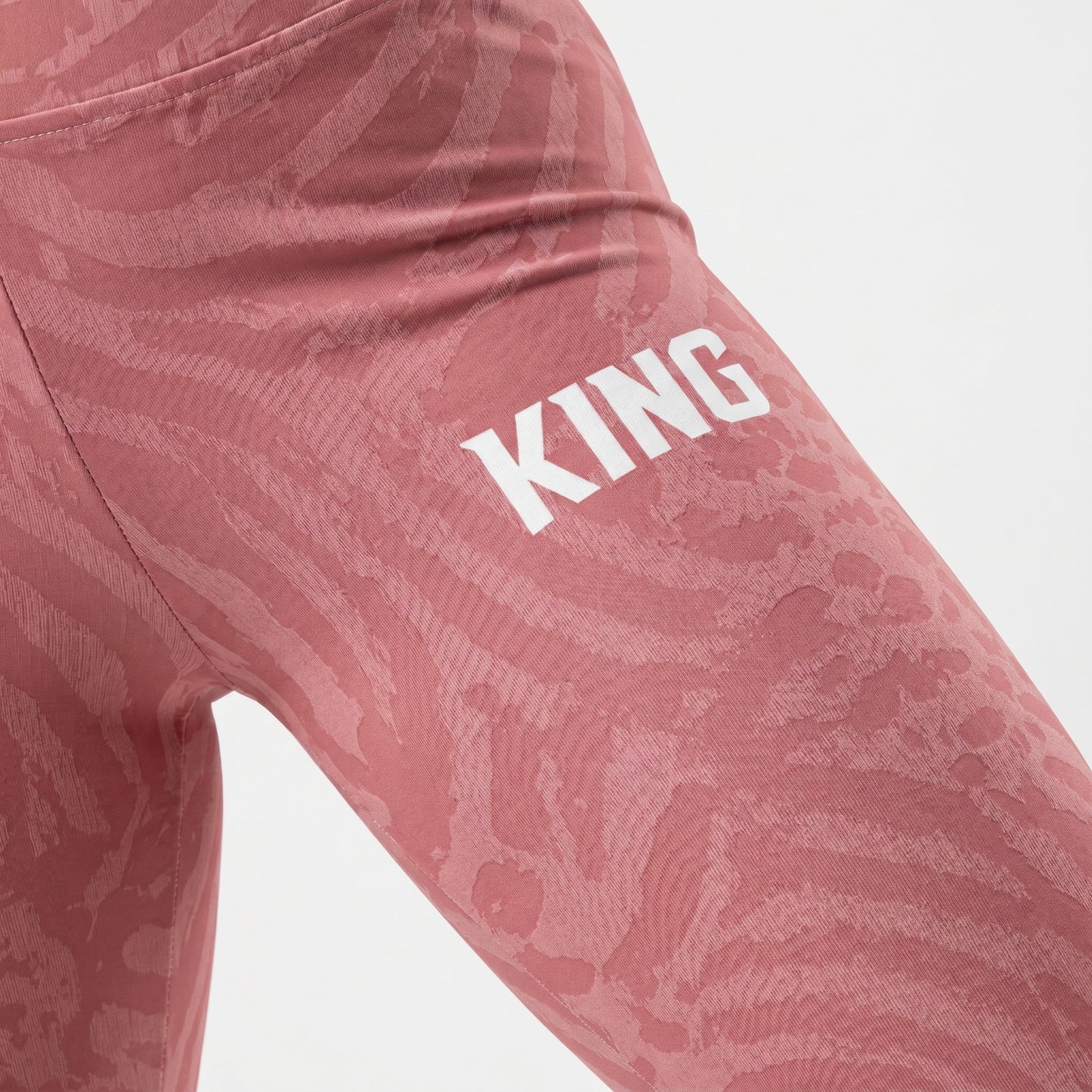 Detailed texture close-up of soft rose shadow pattern activewear leggings