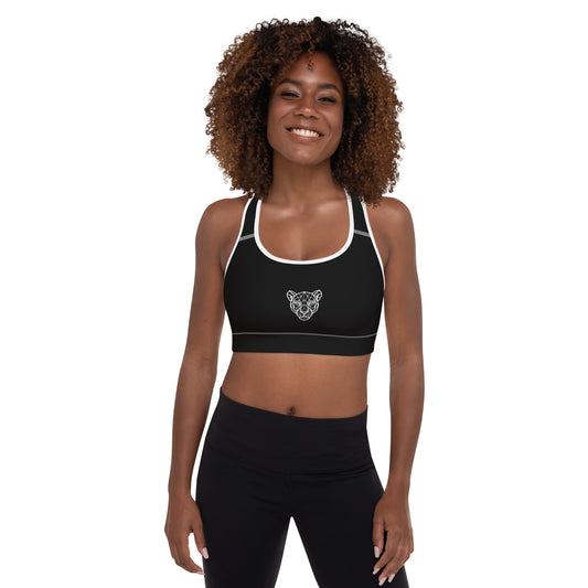 Black Lioness sports bra with white piping and geometric lioness emblem – front view.
