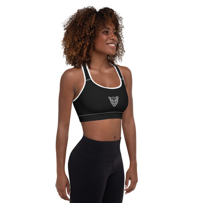Black Lioness sports bra with white piping and geometric lioness emblem – right side view.
