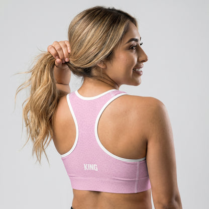 Female athlete showing the back of KING Lioness Sports Bra Rose Scale Edition