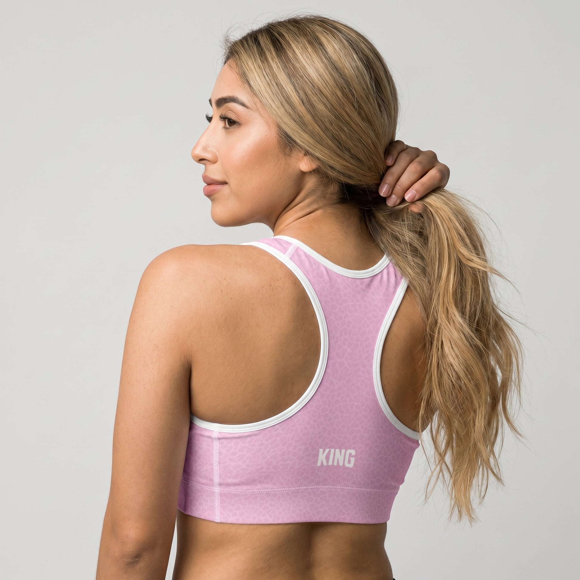 Back view of KING Lioness Sports Bra Rose Scale Edition featuring geometric lioness artwork
