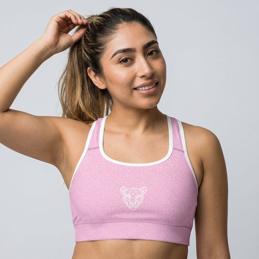 Athlete wearing KING Lioness Sports Bra Rose Scale Edition with geometric lioness design