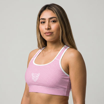 Side front view of KING Lioness Sports Bra Rose Scale Edition on female athlete