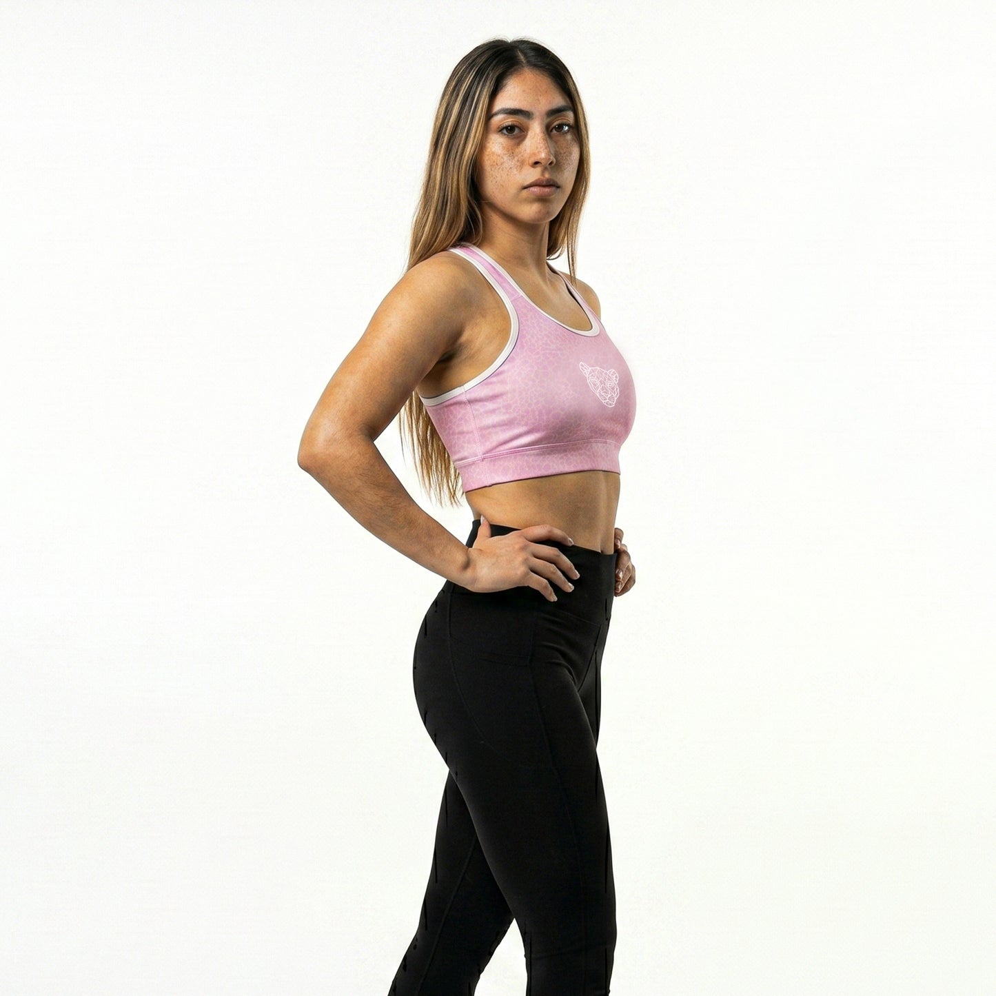 Full body athletic look with KING Lioness rose scale sports bra and leggings