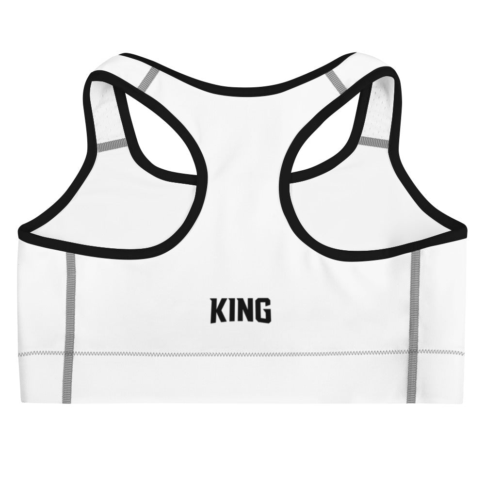Flat product mockup of white KING Lioness sports bra with black piping – back view with KING text logo.