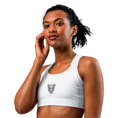 White KING Lioness sports bra – side view with geometric lioness emblem on chest.
