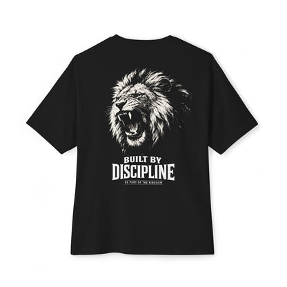 Back view of KING Oversized Tee in black featuring roaring lion artwork and “Built by Discipline” statement print