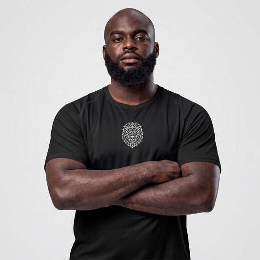 Male athlete wearing the KING APEX black sports jersey with geometric lion chest graphic, front close-up.